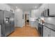 Spacious kitchen featuring stainless steel appliances and access to multiple rooms at 1401 Marshall Farm St, Wake Forest, NC 27587