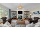 Cozy living room with a fireplace, built-in shelves, comfortable seating, and a stylish area rug at 1401 Marshall Farm St, Wake Forest, NC 27587