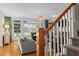 Cozy living room showcasing a large window, hardwood floors and comfortable seating arrangements at 1401 Marshall Farm St, Wake Forest, NC 27587