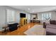 Inviting living room with hardwood floors, media center, and unique Florida-shaped decor at 1401 Marshall Farm St, Wake Forest, NC 27587