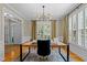 Bright office featuring hardwood floors, a modern light fixture, and view to foyer at 1401 Marshall Farm St, Wake Forest, NC 27587