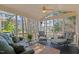 Comfortable screened porch with ample seating and views of the surrounding greenery at 1401 Marshall Farm St, Wake Forest, NC 27587