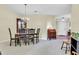 Dining area featuring neutral carpet, decorative lighting, and traditional wood furniture at 1410 Osborne Dr, Burlington, NC 27215