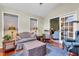 Inviting living room features hardwood floors, a comfortable sofa, and access to additional living space at 1410 Osborne Dr, Burlington, NC 27215