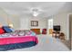 Bright main bedroom with a ceiling fan and a view into the attached bathroom at 1410 Osborne Dr, Burlington, NC 27215