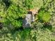 Aerial view of a home surrounded by lush green trees, showcasing the property's privacy and seclusion at 1509 Cumberland Rd, Chapel Hill, NC 27514