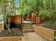 Beautiful backyard features a deck, string lights, and lush greenery at 1509 Cumberland Rd, Chapel Hill, NC 27514
