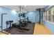 Basement home gym with spiral staircase and rubber flooring at 1509 Cumberland Rd, Chapel Hill, NC 27514