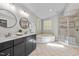 This bathroom has a double sink vanity, a shower, and a tub, providing both convenience and relaxation at 1509 Cumberland Rd, Chapel Hill, NC 27514