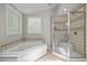 This bathroom has a corner tub and a shower at 1509 Cumberland Rd, Chapel Hill, NC 27514