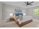 Spacious bedroom with a fan and cozy bedding at 1509 Cumberland Rd, Chapel Hill, NC 27514