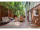Cozy backyard deck with bench seating, dining table, and string lights at 1509 Cumberland Rd, Chapel Hill, NC 27514
