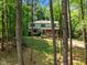 Charming two-story home with a classic design, surrounded by mature trees and lush landscaping at 1509 Cumberland Rd, Chapel Hill, NC 27514