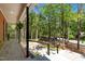 Inviting front porch with stone flooring, iron railings, and a view of the home's landscaped front yard at 1509 Cumberland Rd, Chapel Hill, NC 27514