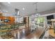 Open kitchen and living space featuring a stone kitchen island and modern appliances at 1509 Cumberland Rd, Chapel Hill, NC 27514