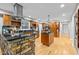 Spacious kitchen with wood cabinets, granite countertops, and stainless steel appliances at 1509 Cumberland Rd, Chapel Hill, NC 27514