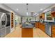 Bright kitchen featuring wood cabinets, stainless appliances, and an island perfect for cooking at 1509 Cumberland Rd, Chapel Hill, NC 27514