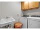 Laundry room with washer, dryer, and sink at 1509 Cumberland Rd, Chapel Hill, NC 27514