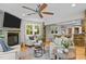 The living room features a stone fireplace, large windows, and is open to the dining area at 1509 Cumberland Rd, Chapel Hill, NC 27514