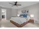This main bedroom features a ceiling fan, carpet flooring and an ensuite bathroom with a single sink vanity at 1509 Cumberland Rd, Chapel Hill, NC 27514