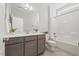 Bathroom with a single sink vanity, with plants, and a shower-tub combo perfect for relaxing at 1513 Armscroft Lane, Apex, NC 27502