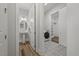 Stylish bathroom with pedestal sink, patterned tile, and convenient access to a laundry room at 1513 Armscroft Lane, Apex, NC 27502