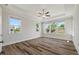 Spacious bedroom with tray ceilings and multiple windows providing ample natural light at 1513 Armscroft Lane, Apex, NC 27502