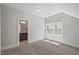 Bedroom with a bathroom and large window with natural light at 1513 Armscroft Lane, Apex, NC 27502