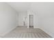 Carpeted bedroom with an entrance to a walk-in closet at 1513 Armscroft Lane, Apex, NC 27502
