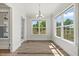 Breakfast nook with large windows and natural light at 1513 Armscroft Lane, Apex, NC 27502