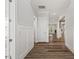 Bright hallway with modern trim, wood-look floors, and views into the living spaces at 1513 Armscroft Lane, Apex, NC 27502