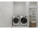 Functional laundry room equipped with new washer and dryer units at 1513 Armscroft Lane, Apex, NC 27502