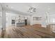 Open-concept living space connecting to a modern kitchen and foyer with wood-look floors at 1513 Armscroft Lane, Apex, NC 27502