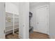 Mudroom with built in shelving, bench, and hooks at 1513 Armscroft Lane, Apex, NC 27502