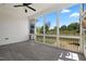 Screened porch featuring floor to ceiling windows with view to backyard at 1513 Armscroft Lane, Apex, NC 27502