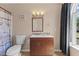 Updated bathroom featuring decorative lighting, tile, and shower-tub combination at 1605 Sassafras St, Durham, NC 27712