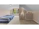 Finished upstairs room with daybed, carpet and lots of natural light at 1605 Sassafras St, Durham, NC 27712