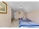 Comfortable bedroom featuring a striped bedspread, sitting chair and neutral wall paint at 1605 Sassafras St, Durham, NC 27712