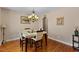 An elegant dining room featuring a modern table set and a decorative chandelier at 1605 Sassafras St, Durham, NC 27712