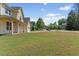 Well-kept lawn with mature landscaping and tree-lined street enhance this homes appeal at 1605 Sassafras St, Durham, NC 27712