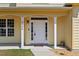 Classic front door framed by sidelights and pillars, set within a cozy covered entry way at 1605 Sassafras St, Durham, NC 27712