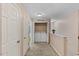 Second floor hallway with laundry nook and multiple rooms at 1605 Sassafras St, Durham, NC 27712