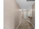 Second story hallway with carpet, neutral paint, and access to bedrooms at 1605 Sassafras St, Durham, NC 27712