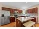 Kitchen with stainless steel appliances, an island, and hardwood floors at 1605 Sassafras St, Durham, NC 27712