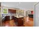 Kitchen featuring a center island, wood cabinets, and stainless steel appliances at 1605 Sassafras St, Durham, NC 27712
