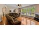 Inviting living room with hardwood floors, large windows, and comfortable furnishings at 1605 Sassafras St, Durham, NC 27712
