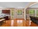 Bright living room boasts hardwood floors, neutral paint, and lots of natural light at 1605 Sassafras St, Durham, NC 27712