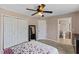 Spacious main bedroom featuring ceiling fan, closet and access to en suite bathroom at 1605 Sassafras St, Durham, NC 27712