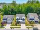 Scenic aerial view of a home in a residential neighborhood, surrounded by lush trees and well-manicured lawns at 1709 Chestnut Falls Rd, Wendell, NC 27591