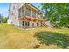 Spacious backyard featuring a screened porch, open deck, and lush lawn perfect for outdoor gatherings at 1709 Chestnut Falls Rd, Wendell, NC 27591